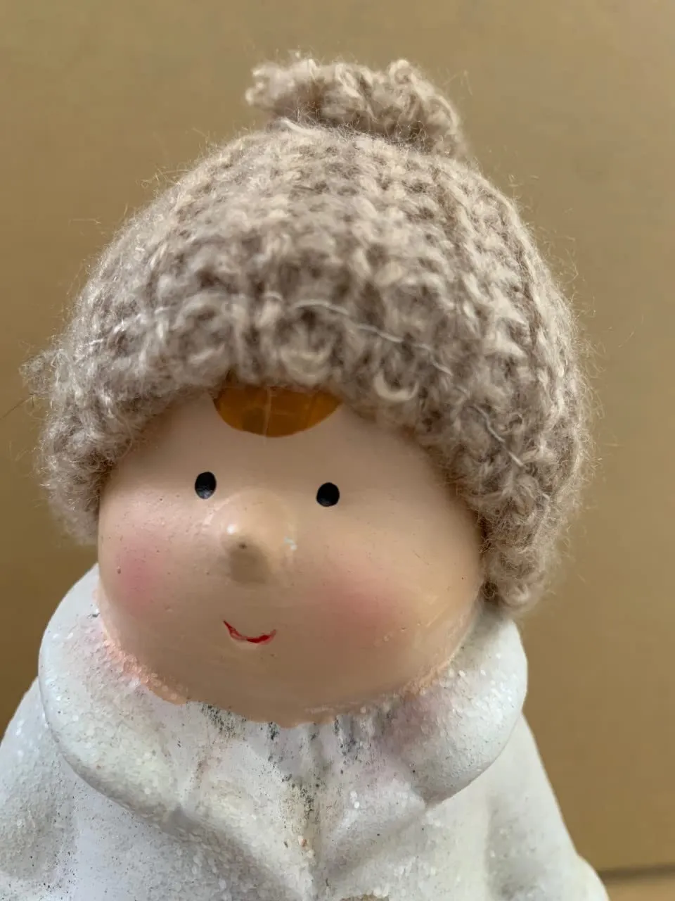 White ceramic Boy with creme coloured woolen hat