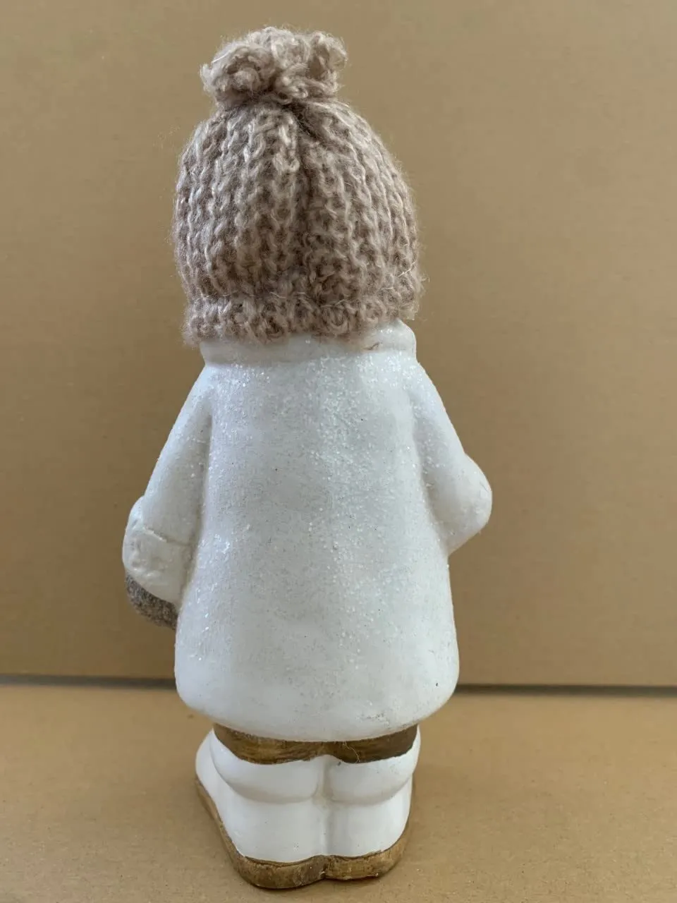 White ceramic Boy with creme coloured woolen hat