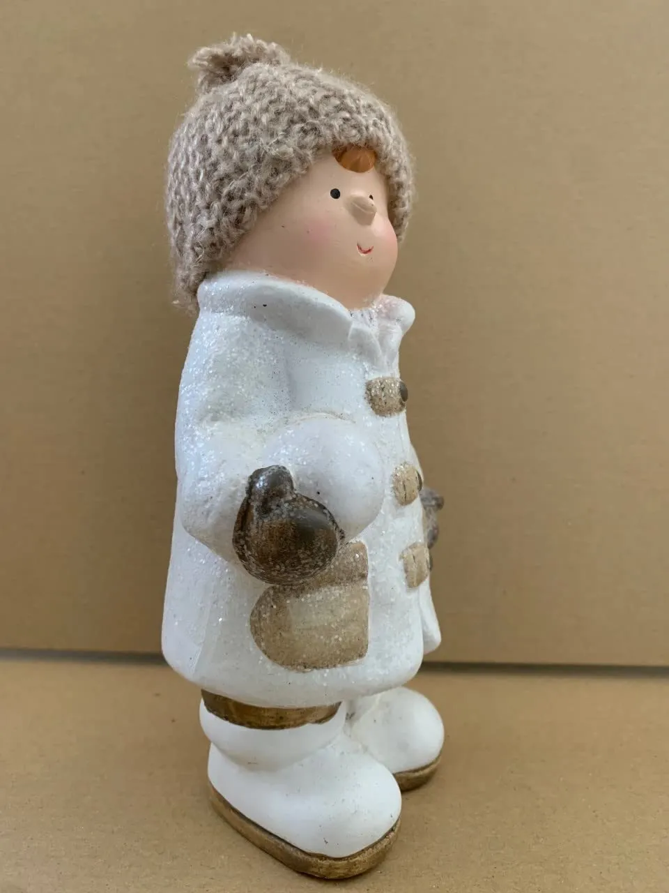 White ceramic Boy with creme coloured woolen hat